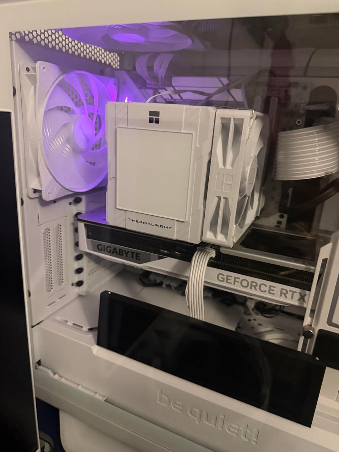 White graphics card, air cooler and matching cables inside the build